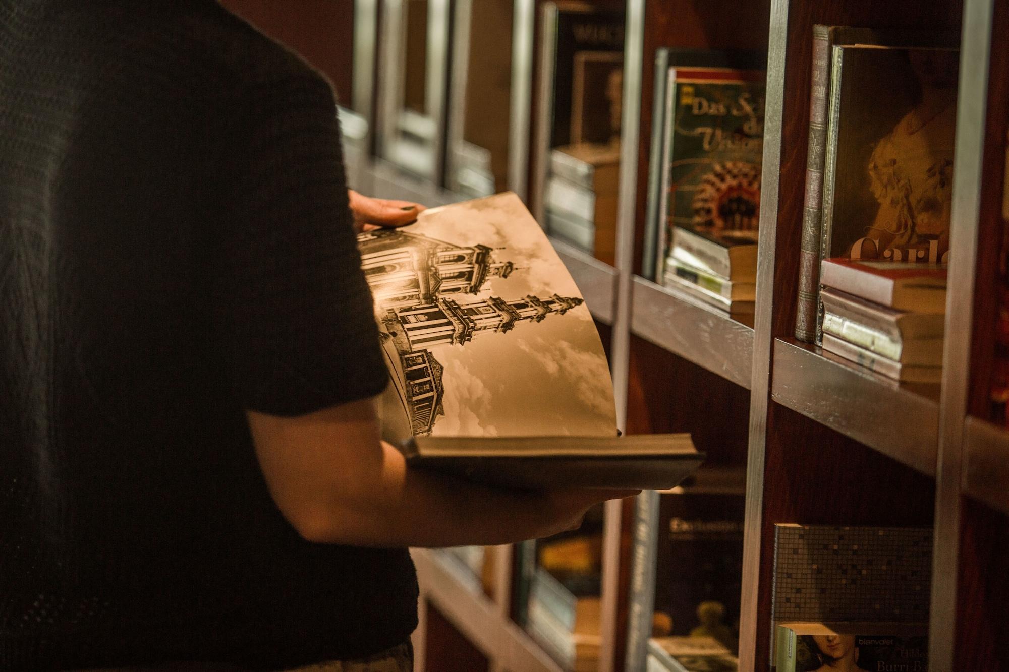Hilton Buenos Aires Hotel Exterior photo A library patron browsing the shelves